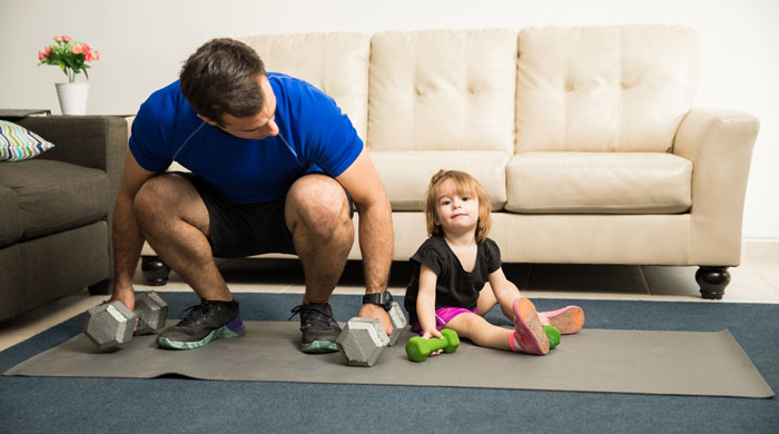 Father and daughter doing exercise