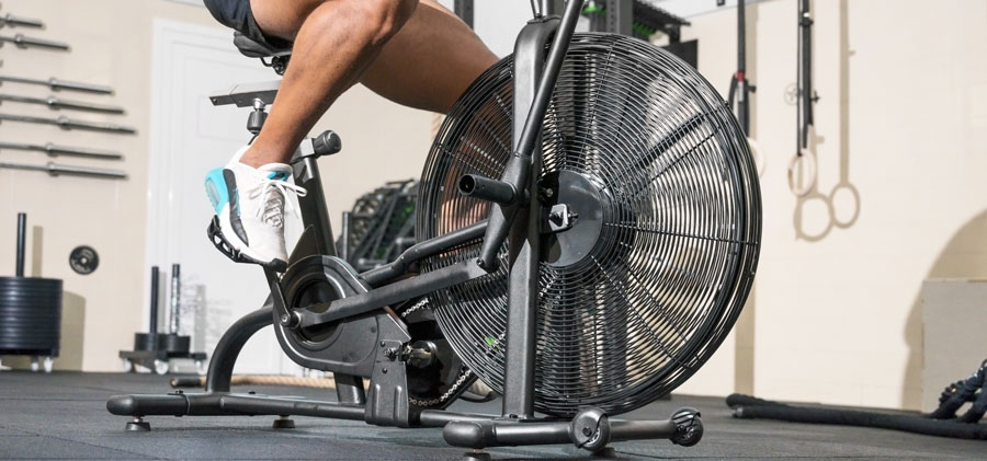 man doing cardio in air bike