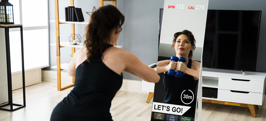 woman using Smart Fitness Mirror