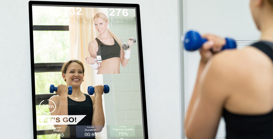 Woman working out w/ smart mirror