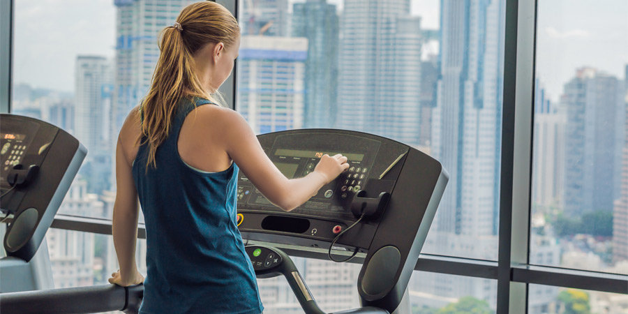 Woman using treadmill