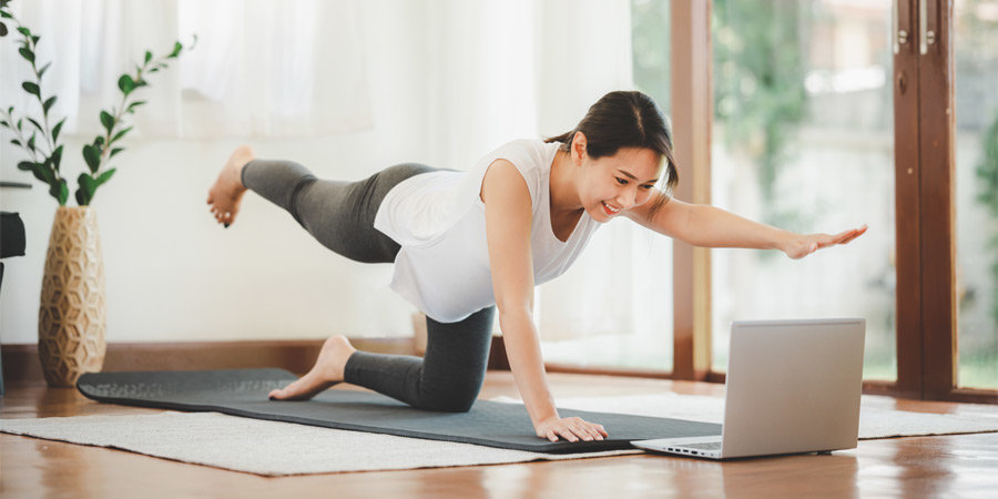 Woman watching guide while working out